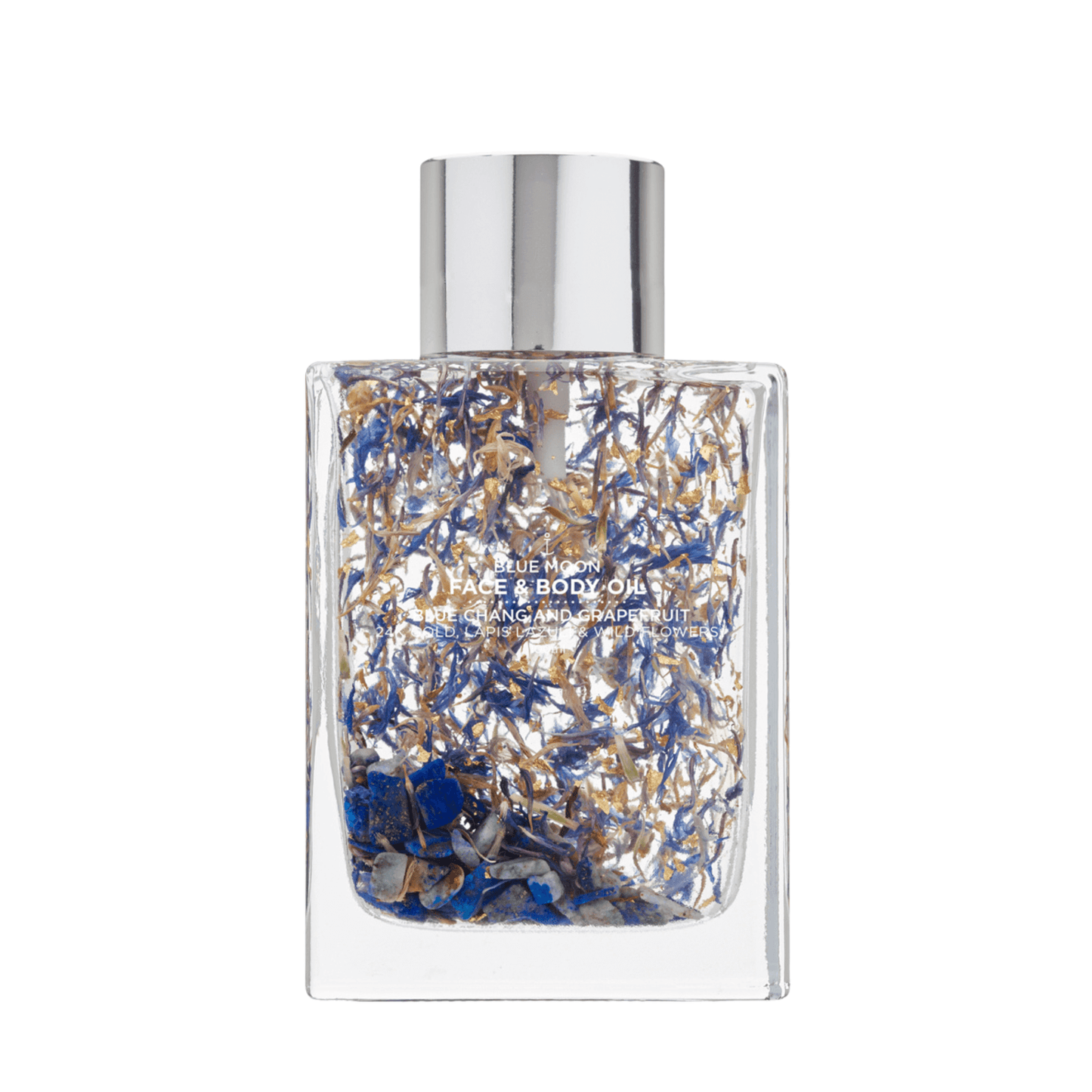 Clear glass bottle of Blue Moon Face & Body Oil from Summer Salt, showcasing its luxurious blend of ingredients including Coconut Oil, Jojoba Oil, Vitamin E, May Chang Essential Oil, Grapefruit Essential Oil, Cornflowers, Lapis Lazuli Crystals, and 24K Gold Leaf. The elegant packaging enhances the product's appeal while highlighting its natural and uplifting qualities.